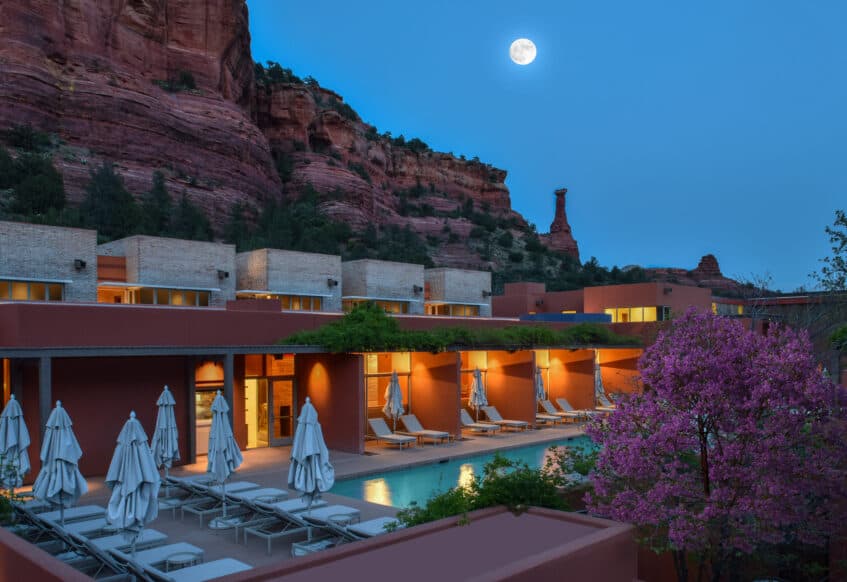 Mii amo pool at dusk with Sedona red rocks in the background